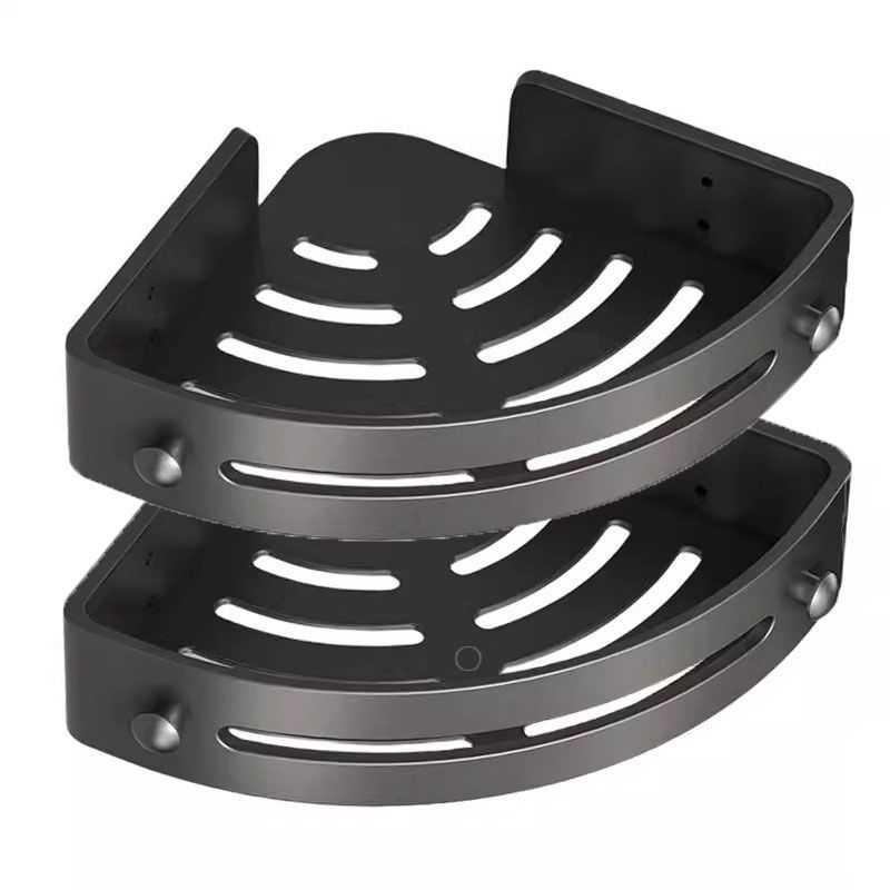 Black plastic wall mounted storage rack in bathroom