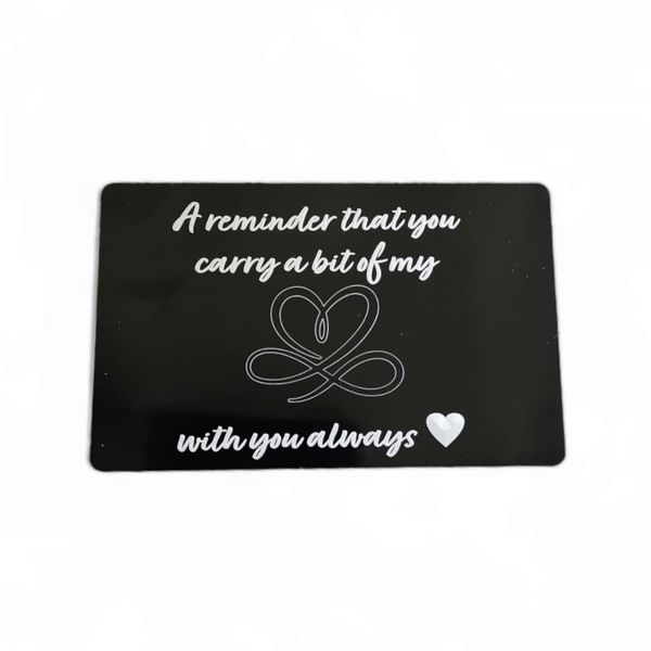 Black aluminum credit card message engraved: You carry a bit of my heart
