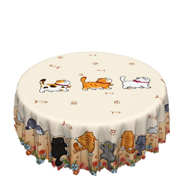 The Cute Kitten And The Tablecloth With Paw Prints Are Perfect For A Family