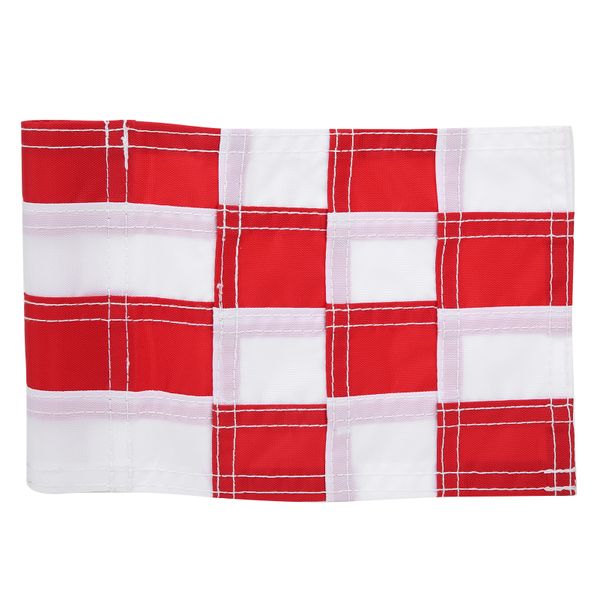 Red/white golf hole flagstick backyard