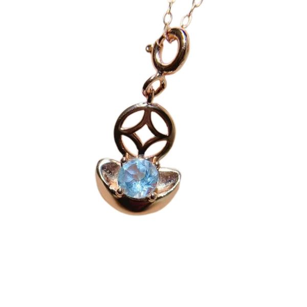Blue Topaz Coin Pendant With Lucky Charm Design