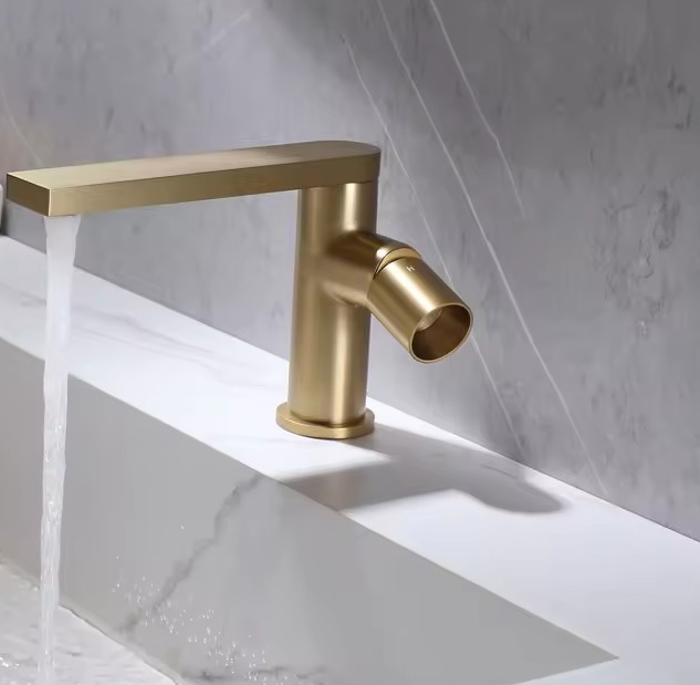 Brass gold basin mixer with twist to open handle