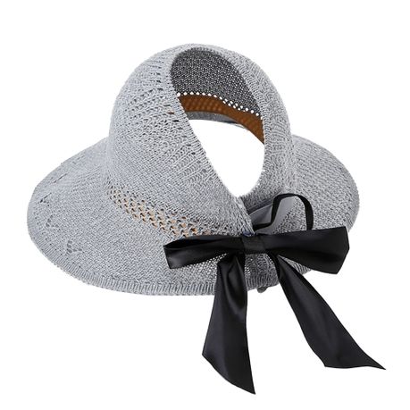 Straw hat with store bow in back