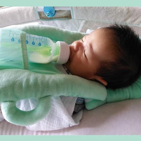 baby pillow with bottle holder